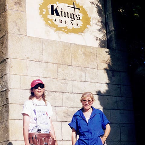standing under sign